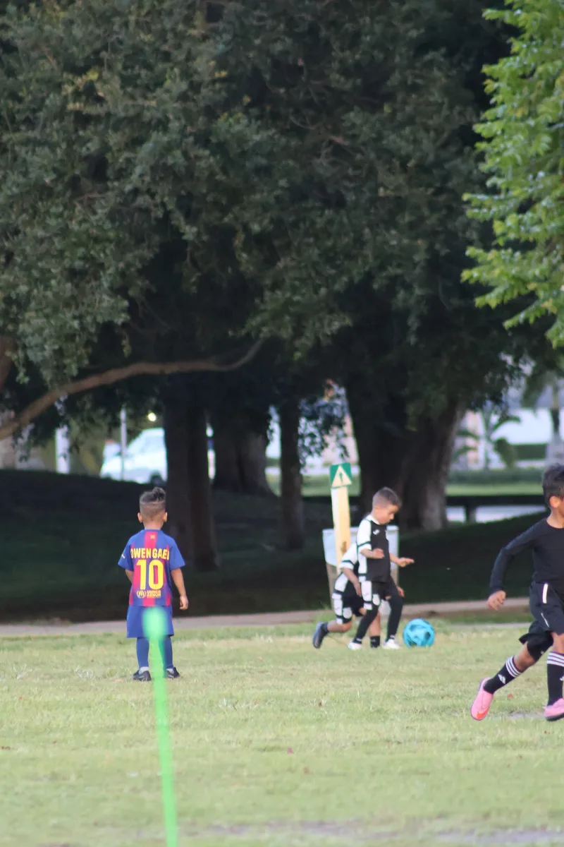 Two young players practice under the trees